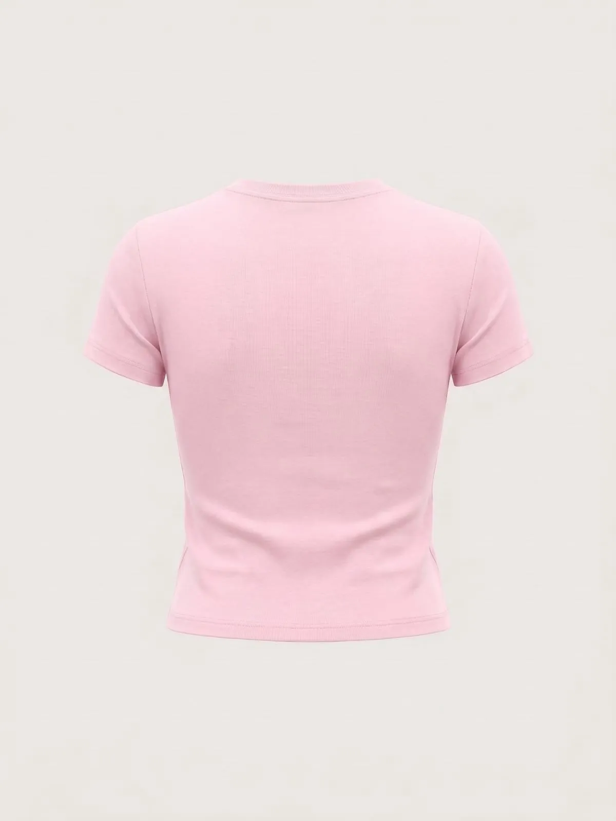 Espalda de la baby tee rosa de The Vibe, lisa