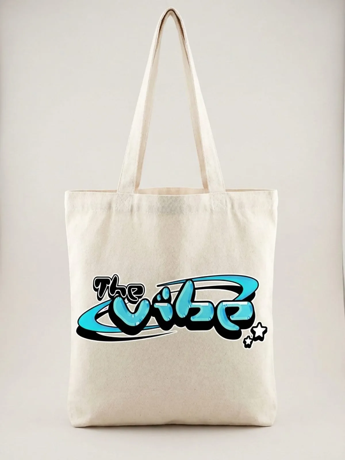 Bolsa de lona cruda con el logo de The Vibe en cian, foto de producto de frente